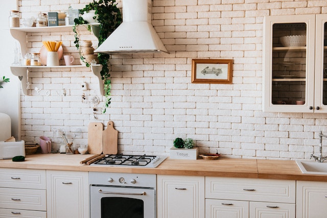 kitchen counter with brick back splash